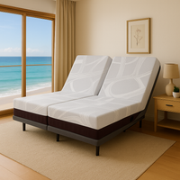  "Split queen 11 inch medium memory foam mattress with adjustable massaging base in bedroom"